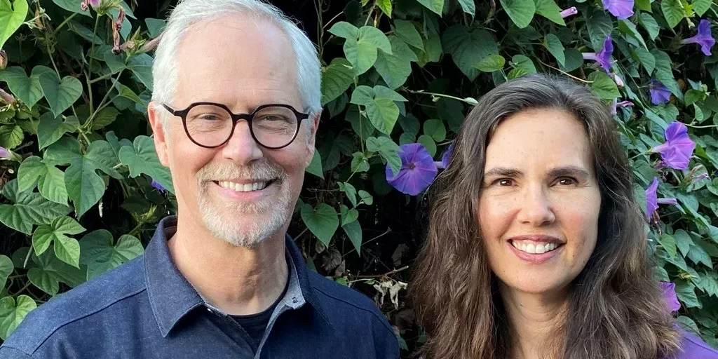 Photo of Chris Germer and Kristin Neff in a forest