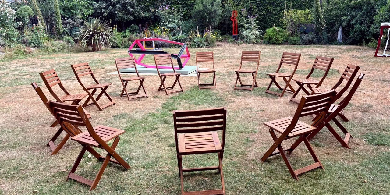 Photo of the garden with seats laid out ready for participants